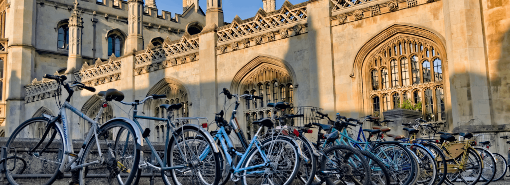 Row of hire bikes outside Kings College Cambridge 